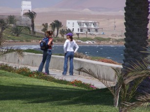 My wife and Jorges girlfriend. Thats jorges place in the background right at the edge of the Natural Reserve. And thats the bay in front that lights up everyday at noon and blows til dark!