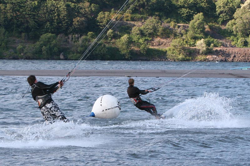 Alex and Jason coming across the finish of lap one. Photo: Pete Goodrich