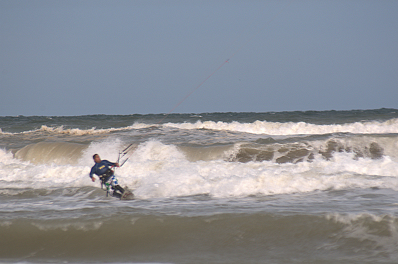 Duke riding some shore break