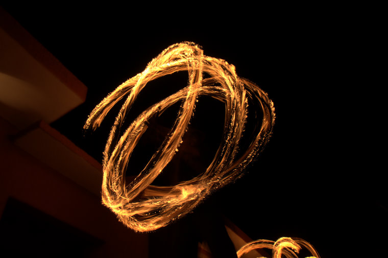 Spinning fire on stilts