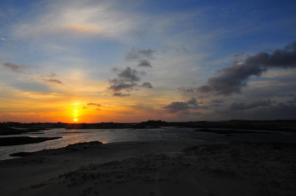 Sunset over some dunes near Baleia.