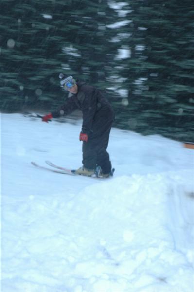 Skier friend pulling the handle back down.