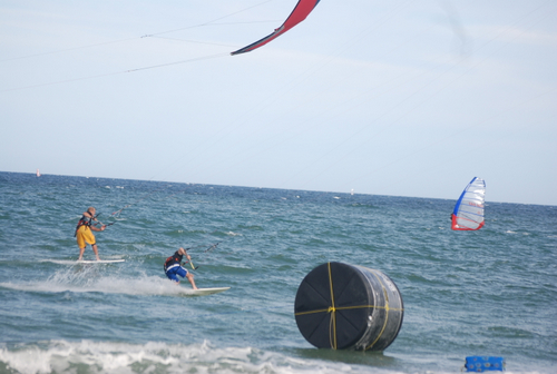 Close finish with the surfboard pulling it out in the last 20 ft.