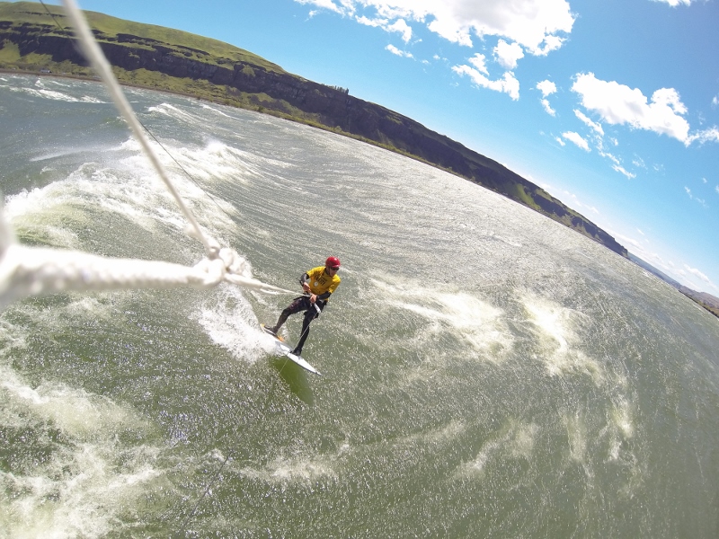 river wide swells with blowing spray