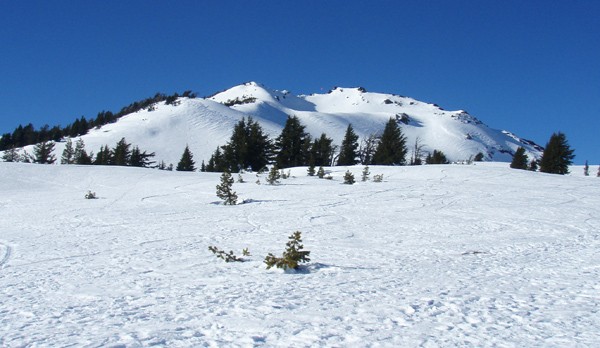 Ken Lucas on his first ascent of Ball Butte. Look close for a kite over the summit in the saddle.