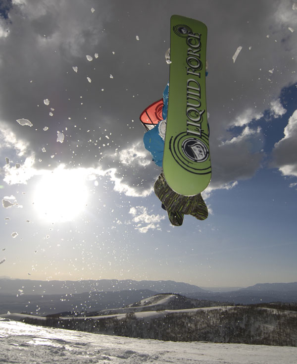 Jason Slezak showing off the hot green LF Alliance snowboard base and sidecut