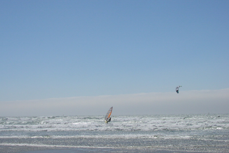 windsurfer Bob and unknown kiter on Naish ripping it up.