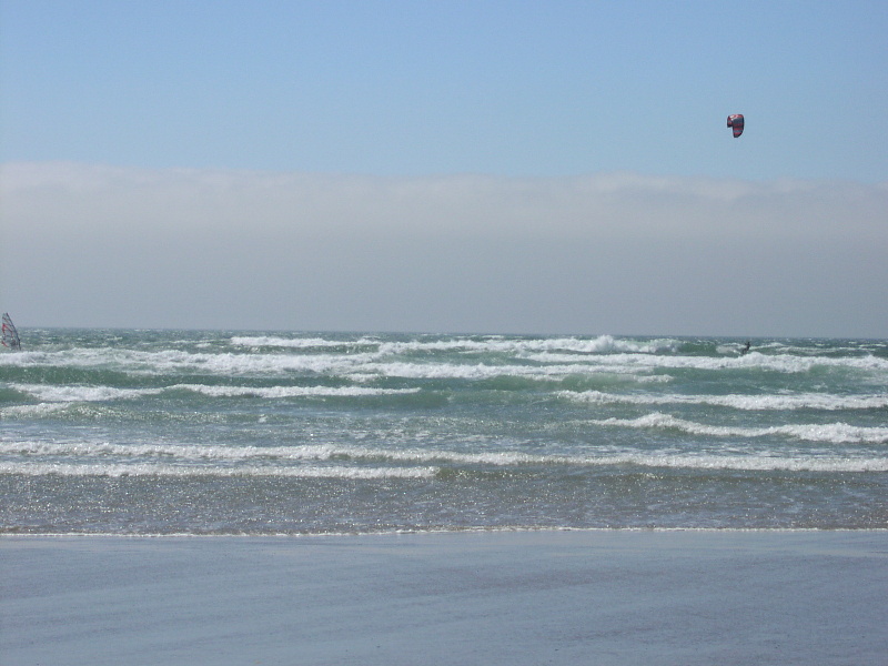 windsurfer cliff and unknown kiter on rev ripping it up.