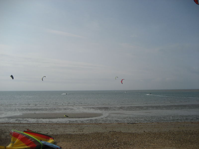 Low tide, flat, waist deep water for about a mile out. Way out there once the tide starts to come in is where the waves are.