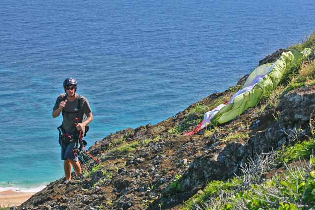 On launch at Koko Crater. Super steep grabby rock, and about a 100ft drop about 4ft from his right foot.