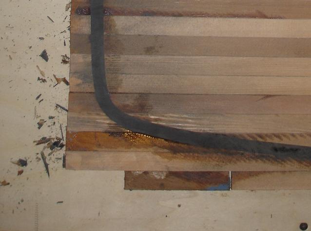 Filled groove with epoxy/cotton fibers/graphite
